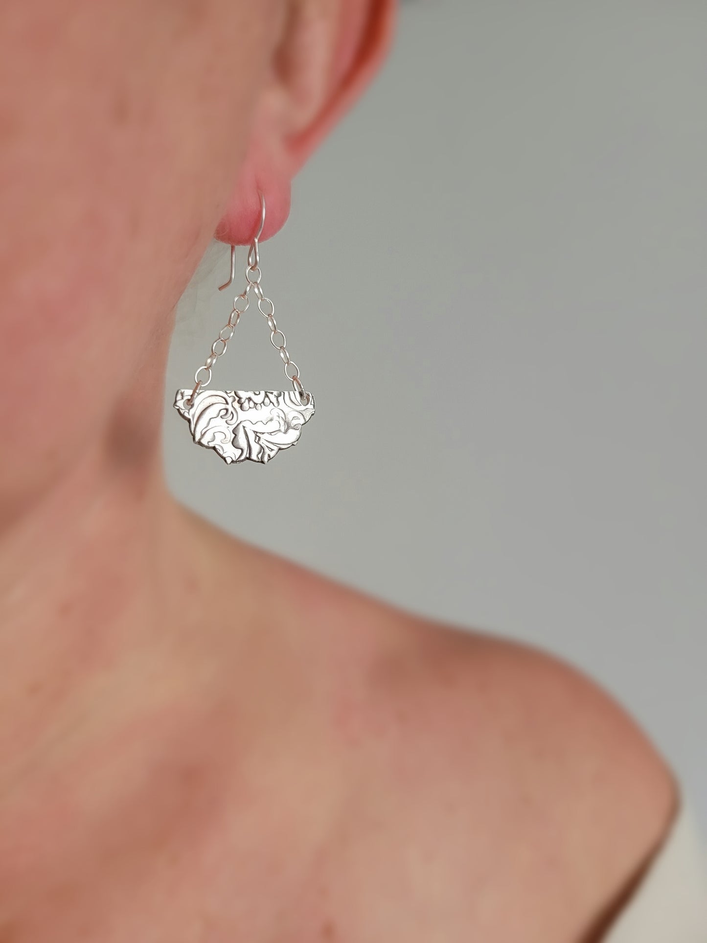 Half medallion earrings